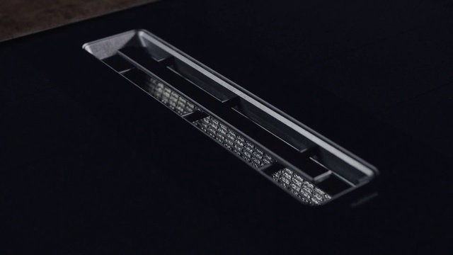 Video Reference: Font, Gadget, Bumper, Rectangle, Automotive design, Personal luxury car, Automotive lighting, Automotive exterior, Electric blue, Laptop