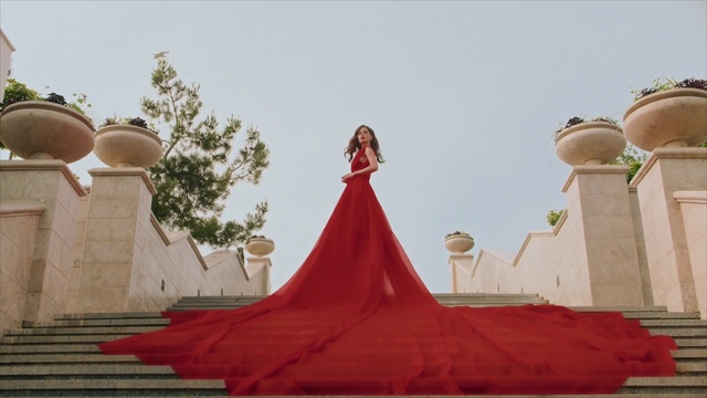 Video Reference: Sky, Temple, Dress, People, Flooring, Landmark, Leisure, Gown, Roof, Art
