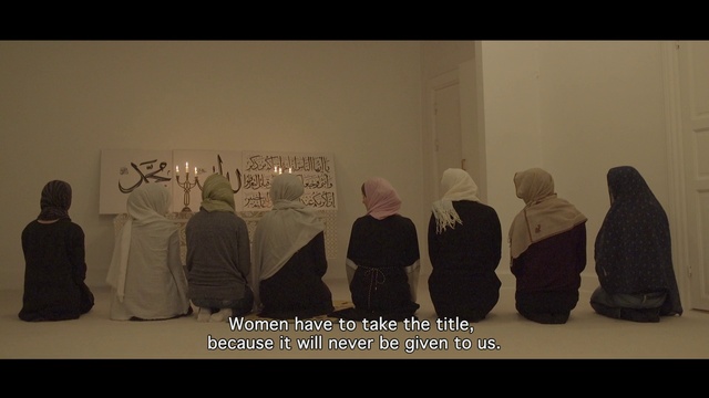 Video Reference: Black, Organism, Headgear, Art, Font, Event, Visual arts, Room, Shadow, Animation