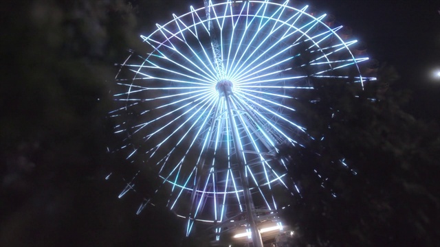 Video Reference: Sky, Entertainment, Fireworks, Ferris wheel, Electric blue, Recreation, Darkness, Event, Space, Midnight