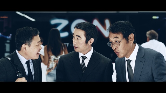 Video Reference: Coat, Tie, Suit, Gesture, Dress shirt, Flash photography, Collar, Microphone, Blazer, Formal wear