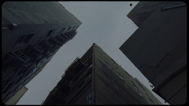 Video Reference: Sky, Building, Skyscraper, Grey, Tower block, World, Tints and shades, Composite material, Urban design, Symmetry