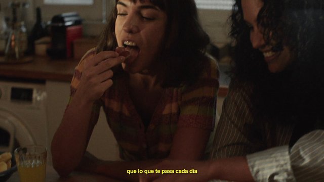 Video Reference: indoor, dining table, people, eating, close-up, conversation, subtitles, home, casual, meal, night, lifestyle
