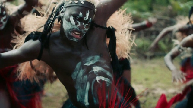 Video Reference: Eye, Grass, Chest, Event, Fictional character, Jewellery, Costume, Tradition, Flesh, Public event