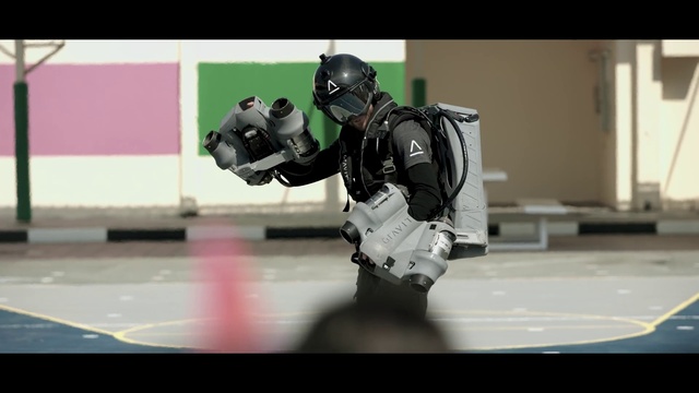 Video Reference: Personal protective equipment, Machine, Font, Carmine, Safety glove, Recreation, Fictional character, Cameras & optics, Toy, Robot