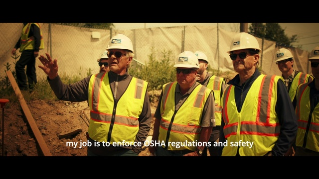 Video Reference: Helmet, High-visibility clothing, Hard hat, Workwear, Green, Sleeve, Plant, Headgear, Engineer, Tree