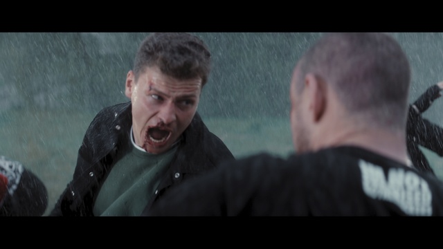 Video Reference: Mouth, Flash photography, Jaw, Gesture, Formal wear, Facial hair, Event, Movie, Sitting, Darkness