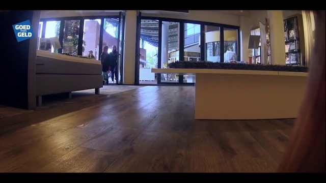 Video Reference: Wood, Couch, Hall, Flooring, Interior design, Floor, Building, Laminate flooring, Wood stain, Hardwood