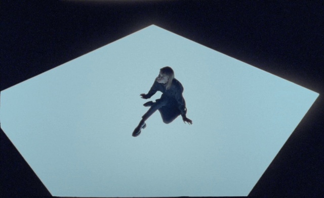 Video Reference: Sleeve, Rectangle, Gesture, Triangle, Font, Art, Slope, Electric blue, Recreation, Illustration