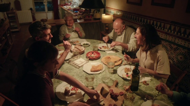 Video Reference: Food, Table, Tableware, Picture frame, Muscle, Sharing, Human, Plate, Chair, Cuisine