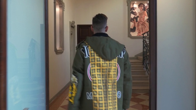 Video Reference: Sleeve, Interior design, Picture frame, Street fashion, T-shirt, Sportswear, Art, Fashion design, Event, Flooring