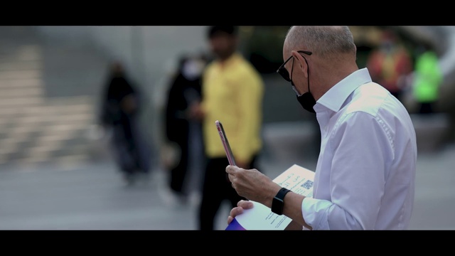 Video Reference: Watch, Glasses, Gesture, Gadget, Audio equipment, Event, Eyewear, White-collar worker, Communication Device, Official