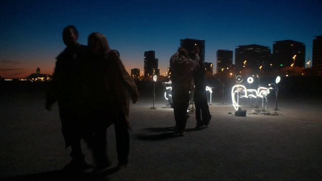 Video Reference: Sky, Gesture, Dusk, City, Horizon, Building, Landscape, Event, Darkness, Backlighting