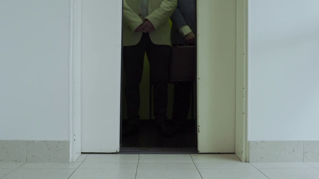 Video Reference: Mirror, Door, Sleeve, Fixture, Wood, Grey, Flooring, Floor, Home door, Blazer