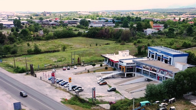 Video Reference: Plant, Building, Sky, Tree, Land lot, Urban design, Neighbourhood, Window, Car, Landscape