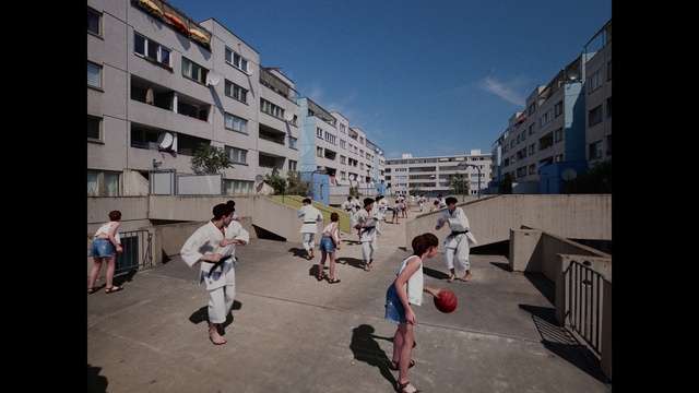 Video Reference: Footwear, Sky, Shorts, Building, Window, Urban design, Residential area, Condominium, City, Travel