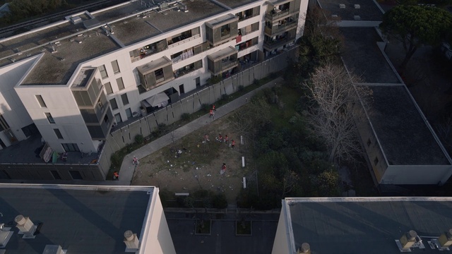 Video Reference: Building, Window, Urban design, Tree, Thoroughfare, Condominium, Residential area, Tower block, Facade, Morning