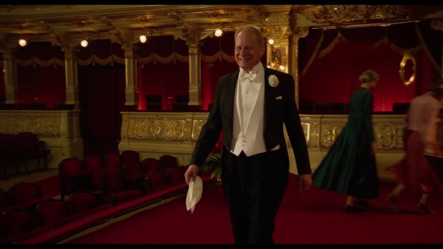 Video Reference: Entertainment, Curtain, Fashion design, Chair, Suit, Formal wear, Flooring, Event, Magenta, Fun