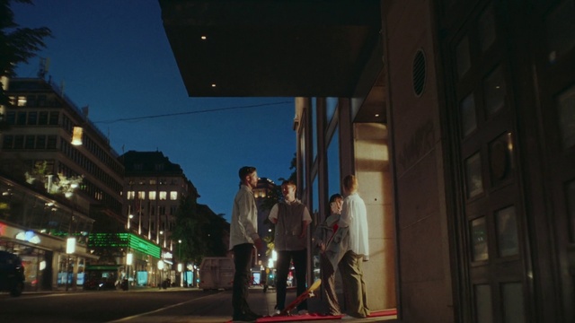 Video Reference: Sky, Building, Window, Street light, Electricity, Road surface, City, Facade, Road, Midnight