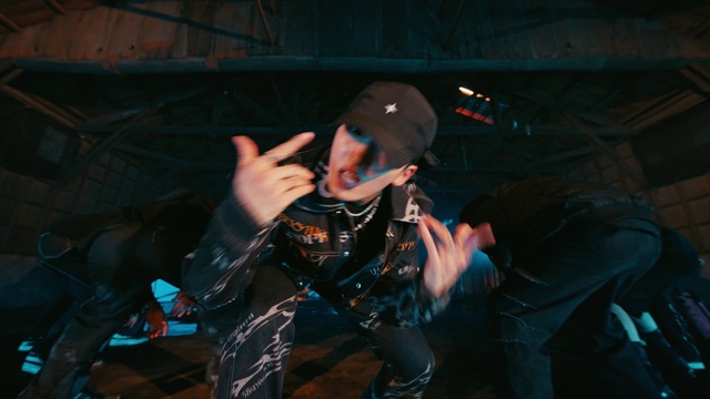 Video Reference: Microphone, Cap, Flash photography, Artist, Baseball cap, String instrument, Musician, Hat, Plucked string instruments, Music