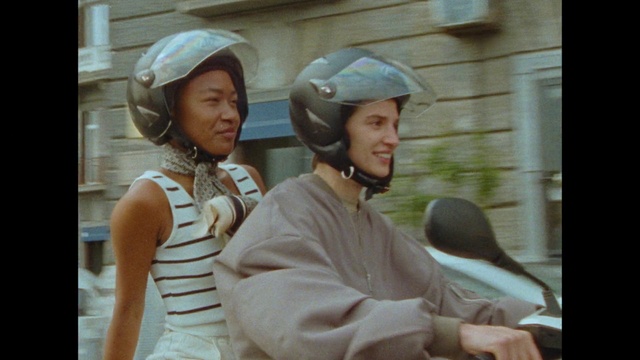 Video Reference: Smile, Helmet, Gesture, Happy, Travel, Motor vehicle, Personal protective equipment, Leisure, Fun, Event