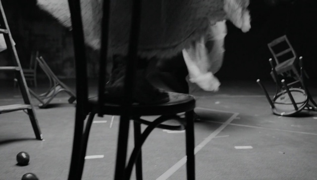Video Reference: Furniture, Black, Chair, Standing, Mammal, Black-and-white, Grey, Style, Entertainment, Musician