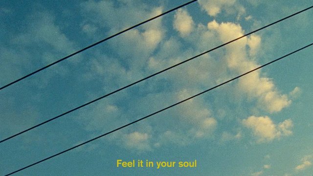 Video Reference: sky, clouds, power lines, subtitle, text overlay, blue sky, outdoor, atmosphere, minimal, diagonal lines