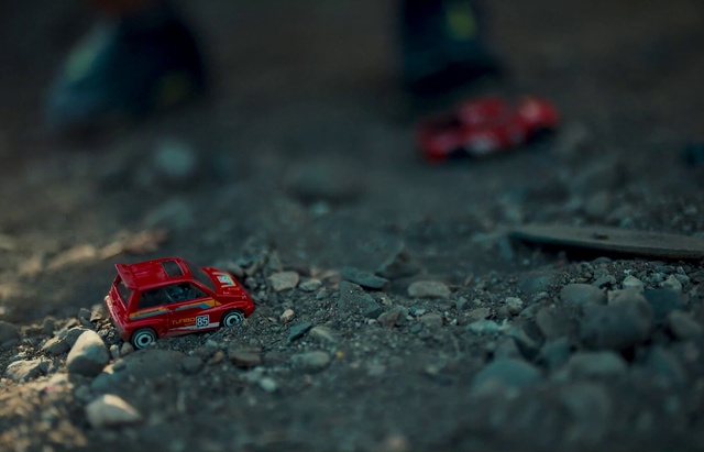 Video Reference: Automotive tire, Toy, Motor vehicle, Tire, Asphalt, Road surface, Automotive design, Automotive lighting, Automotive wheel system, Flooring