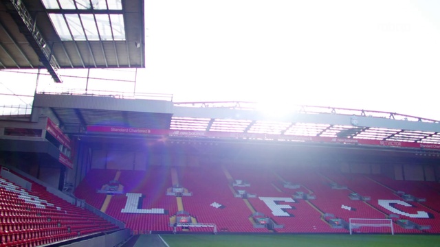 Video Reference: Sky, Building, Stadium, Urban design, Grass, Sport venue, Arena, City, Rectangle, Display device