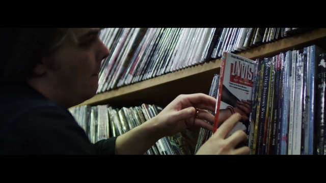 Video Reference: Hand, Publication, Gesture, Bookcase, Shelf, Tints and shades, Book, Art, Shelving, Font