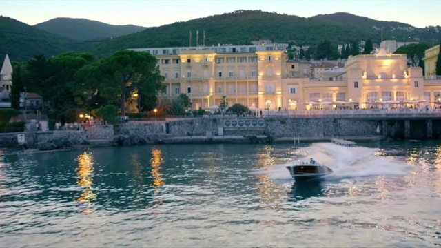 Video Reference: Water, Sky, Building, Boat, Watercraft, Azure, Cloud, Mountain, Lake, Body of water