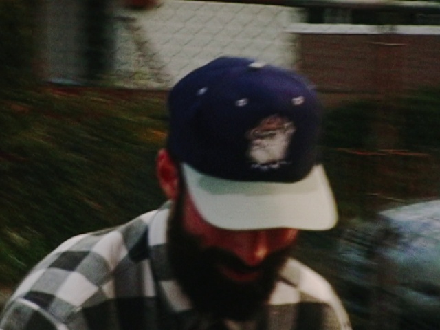 Video Reference: Sports gear, Tartan, Jaw, Cap, Plaid, Personal protective equipment, T-shirt, Street fashion, Beard, Plant