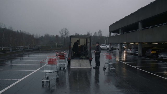 Video Reference: Sky, Vehicle, Road surface, Asphalt, Building, Car, Tree, Grey, Truck, Gas