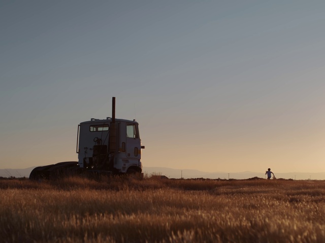 Video Reference: Sky, Plant, Vehicle, Tire, Agriculture, Grassland, Truck, Plain, Landscape, Prairie