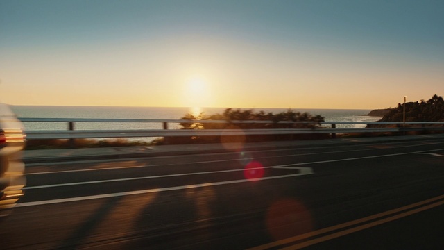 Video Reference: Sky, Atmosphere, Water, Afterglow, Road surface, Asphalt, Automotive lighting, Sunlight, Mode of transport, Dusk