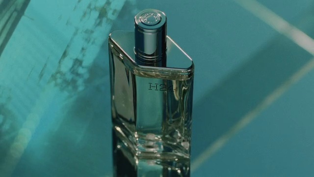 Video Reference: Liquid, Perfume, Bottle, Fluid, Drinkware, Aqua, Glass bottle, Art, Electric blue, Solvent