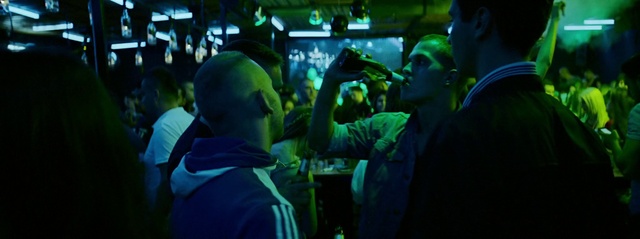 Video Reference: Hat, Entertainment, Jacket, Leisure, Event, Technology, Fun, Crowd, T-shirt, Music