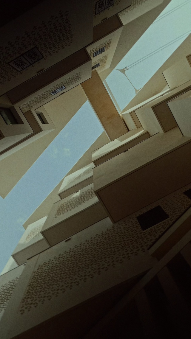 Video Reference: Building, Rectangle, Sky, Fixture, Urban design, Font, Tower block, Material property, Composite material, Symmetry