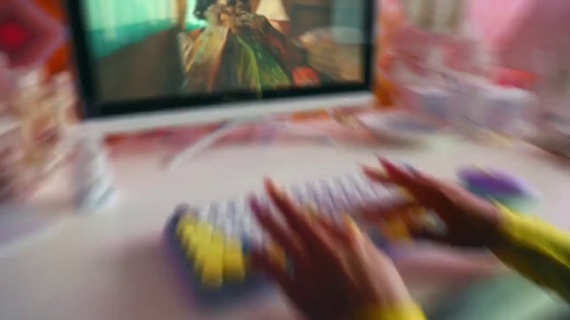 Video Reference: Gesture, Yellow, Fun, Art, Magenta, Technology, Electronic device, Television set, Wood, Thumb