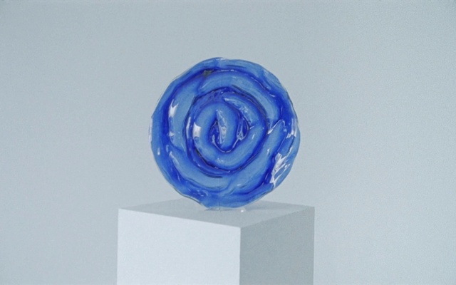 Video Reference: Blue, Wheel, Art, Sculpture, Electric blue, Circle, Automotive wheel system, Glass, Rectangle, Font