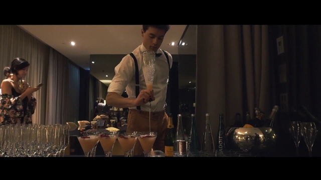 Video Reference: Tableware, Sleeve, Flash photography, Formal wear, Event, Fashion design, Cooking, Drinkware, Hat, Darkness