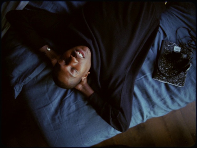 Video Reference: Comfort, Flash photography, Sleeve, Gesture, T-shirt, Elbow, Linens, Happy, Bed, Darkness