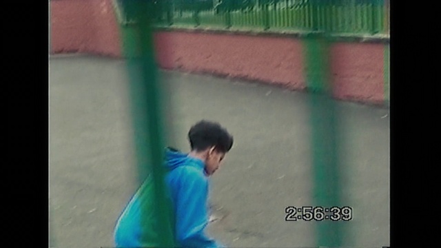 Video Reference: Player, T-shirt, Tints and shades, Rectangle, Font, Magenta, Leisure, Sportswear, Recreation, Display device