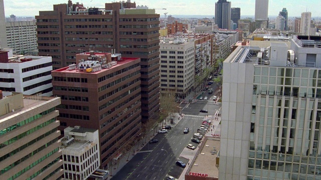 Video Reference: Building, Skyscraper, Daytime, Sky, Window, Infrastructure, Car, Urban design, Architecture, Neighbourhood