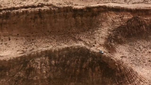 Video Reference: Brown, Bedrock, Slope, Terrain, Formation, Geological phenomenon, Landscape, Outcrop, Geology, Grass