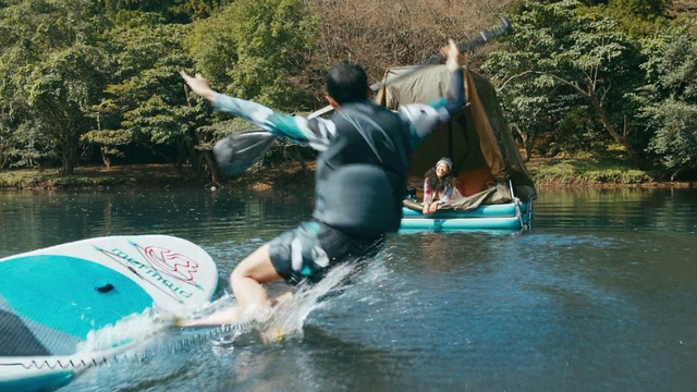 Video Reference: Water, Plant, Lake, Surfing, Surfboard, Tree, People in nature, Leisure, Shorts, Recreation