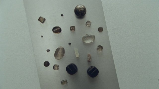 Video Reference: wall, decorative, stones, gems, panel, close-up, abstract, interior, texture, arrangement, minimal, light-colored, mounted, ornament, small objects