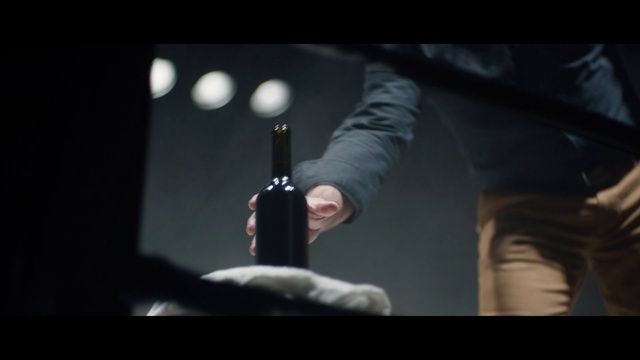 Video Reference: Flash photography, Bottle, Gesture, Entertainment, Event, Performing arts, Audio equipment, Font, Drink, Darkness