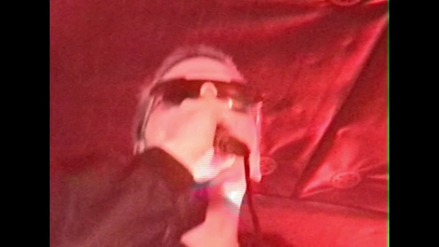 Video Reference: Jaw, Sleeve, Gesture, Sunglasses, Beard, Magenta, Event, Petal, Eyewear, Carmine