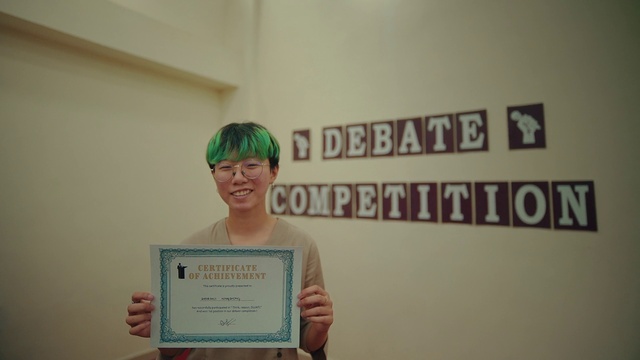 Video Reference: Face, Smile, Dress, Font, T-shirt, Happy, Event, Academic certificate, Room, Art